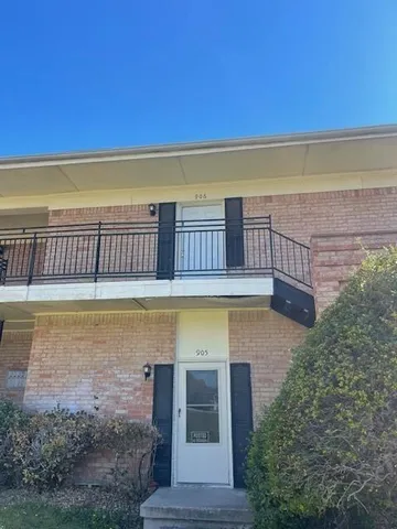a view of a swimming pool with a lounge chair