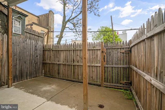 a view of a balcony with wooden fence