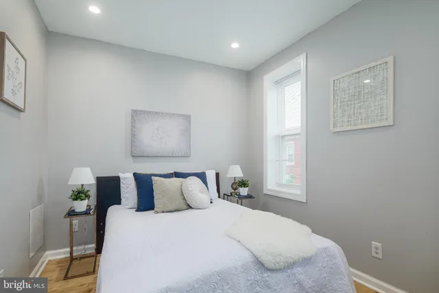 a bedroom with a bed and window