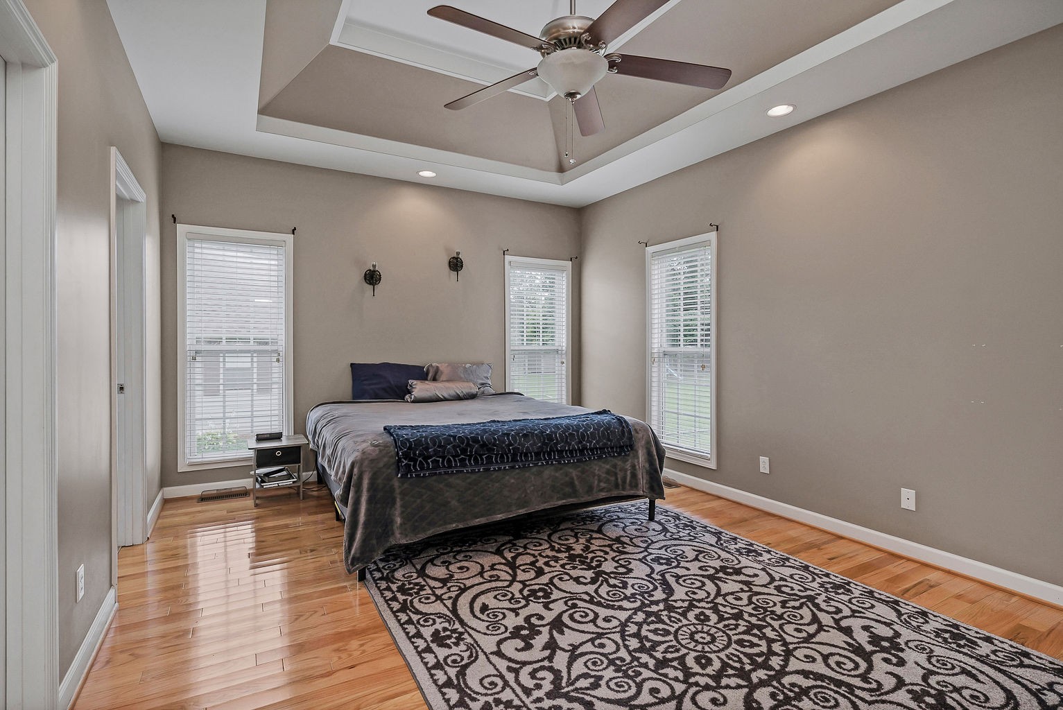 164 Simons Boulevard Morrison, TN 37357 - Photo 15 of 16 a bedroom with a bed and wooden floor