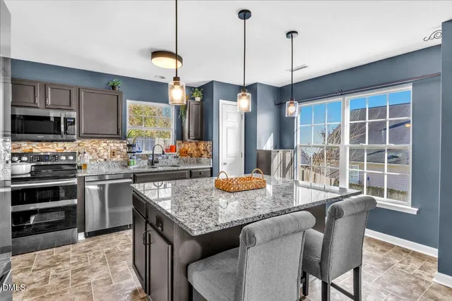 a kitchen with granite countertop lots of counter top space