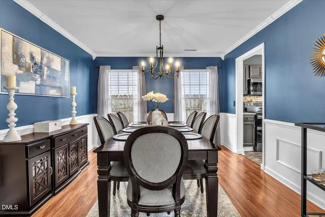 a bedroom with a bed dresser and a window