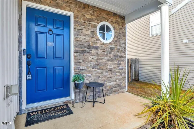 a view of a door and chair in the house