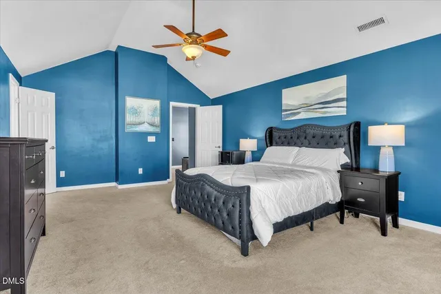 a bathroom with a granite countertop shower sink and mirror