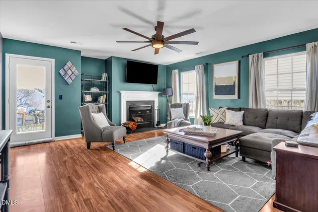a living room with furniture fireplace and a flat screen tv