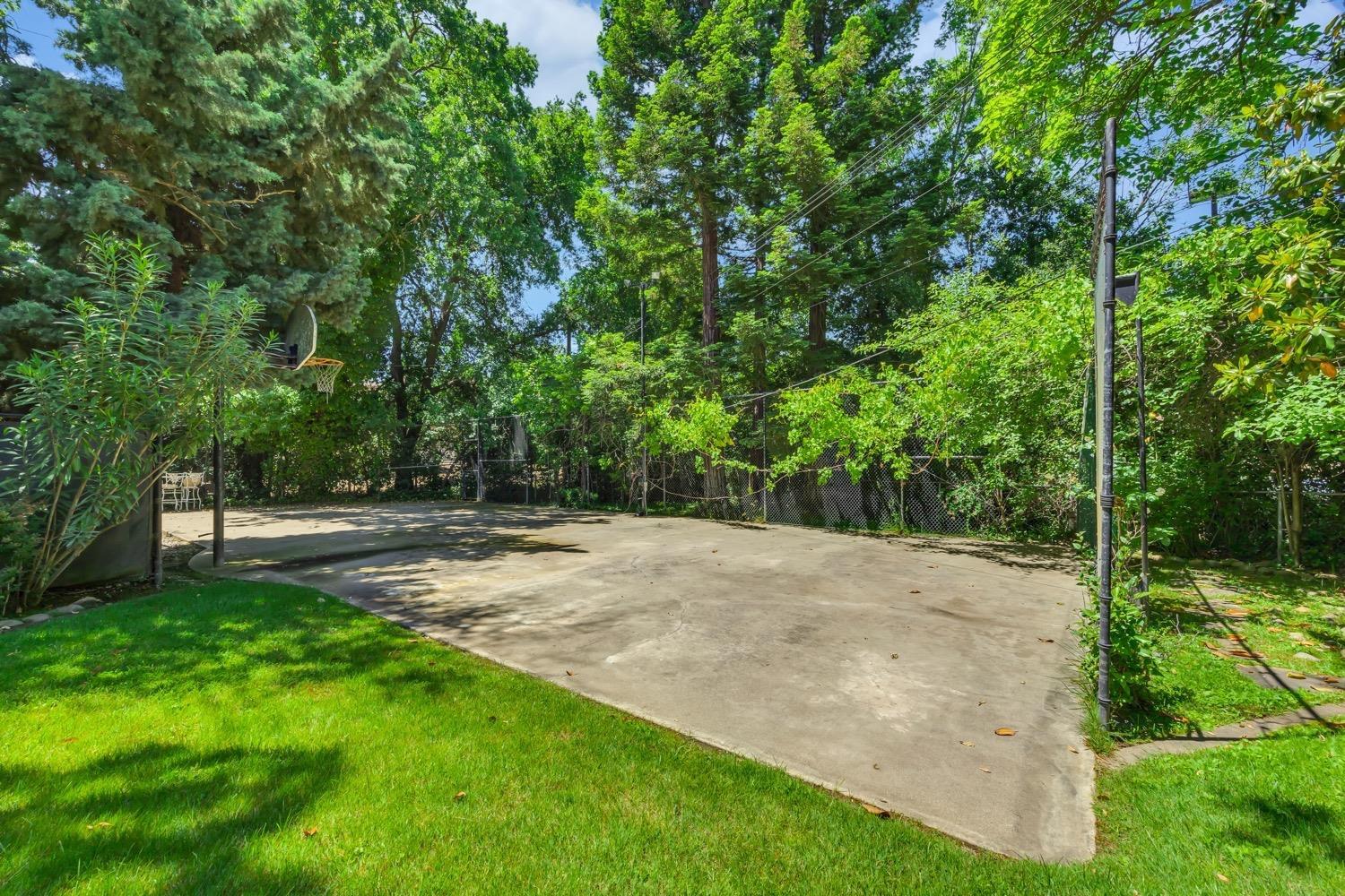 557 Crocker Road Sacramento, CA 95864 - Photo 19 of 21 Spacious multipurpose court off the pool area, perfect for kids to play and enjoy various activities.