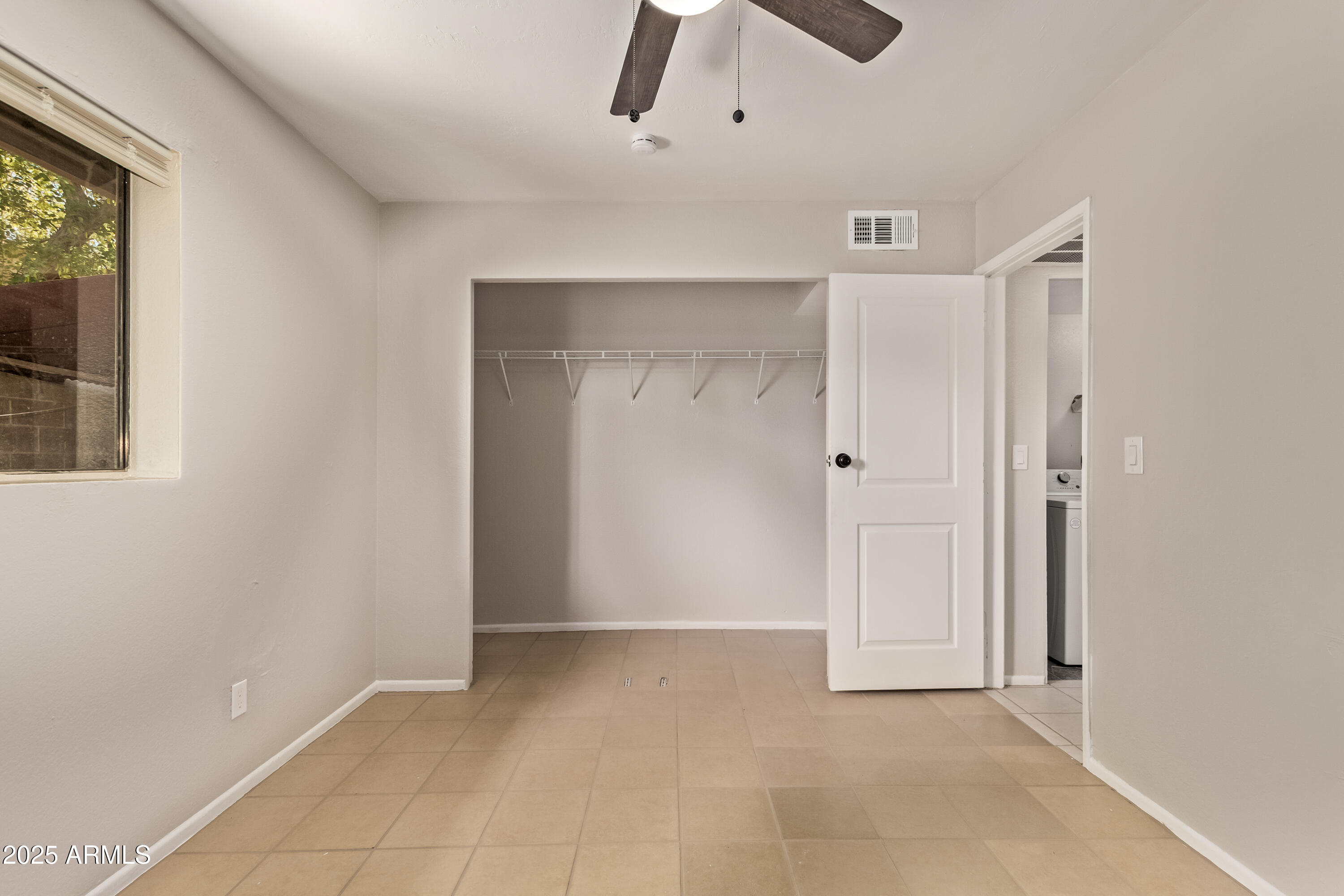 514 South Bellview, Unit 1 Mesa, AZ 85204 - Photo 13 of 19 an empty room with windows and closet