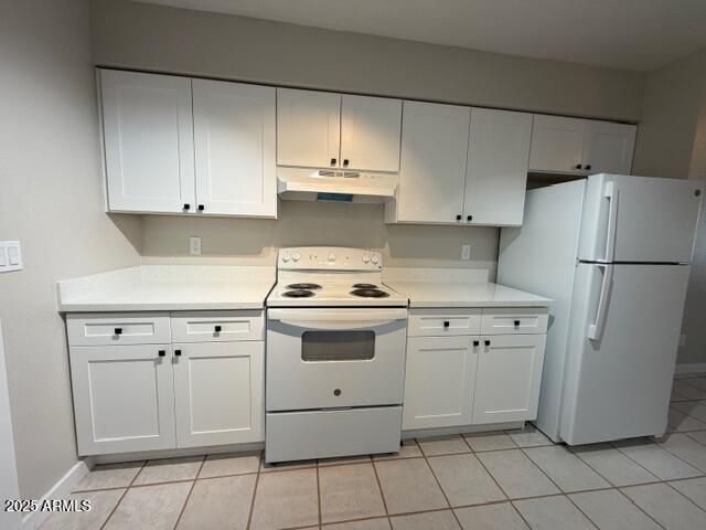 514 South Bellview, Unit 1 Mesa, AZ 85204 - Photo 9 of 21 a kitchen with white cabinets and white appliances