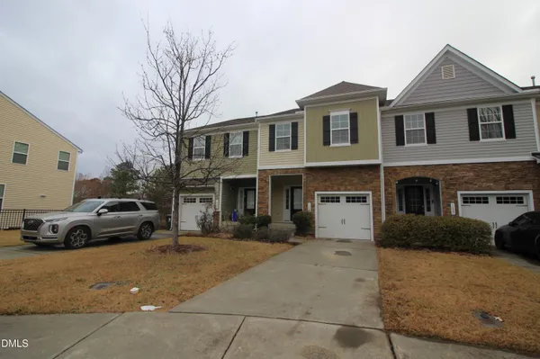 a view of multiple houses with a yard