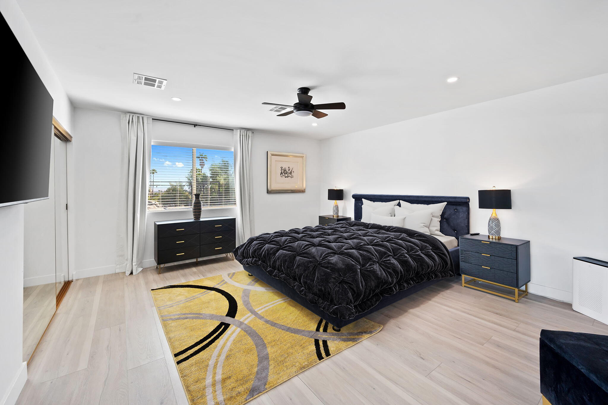 2380 North Leonard Road Palm Springs, CA 92262 - Photo 18 of 54 a bedroom with a bed and wooden floor