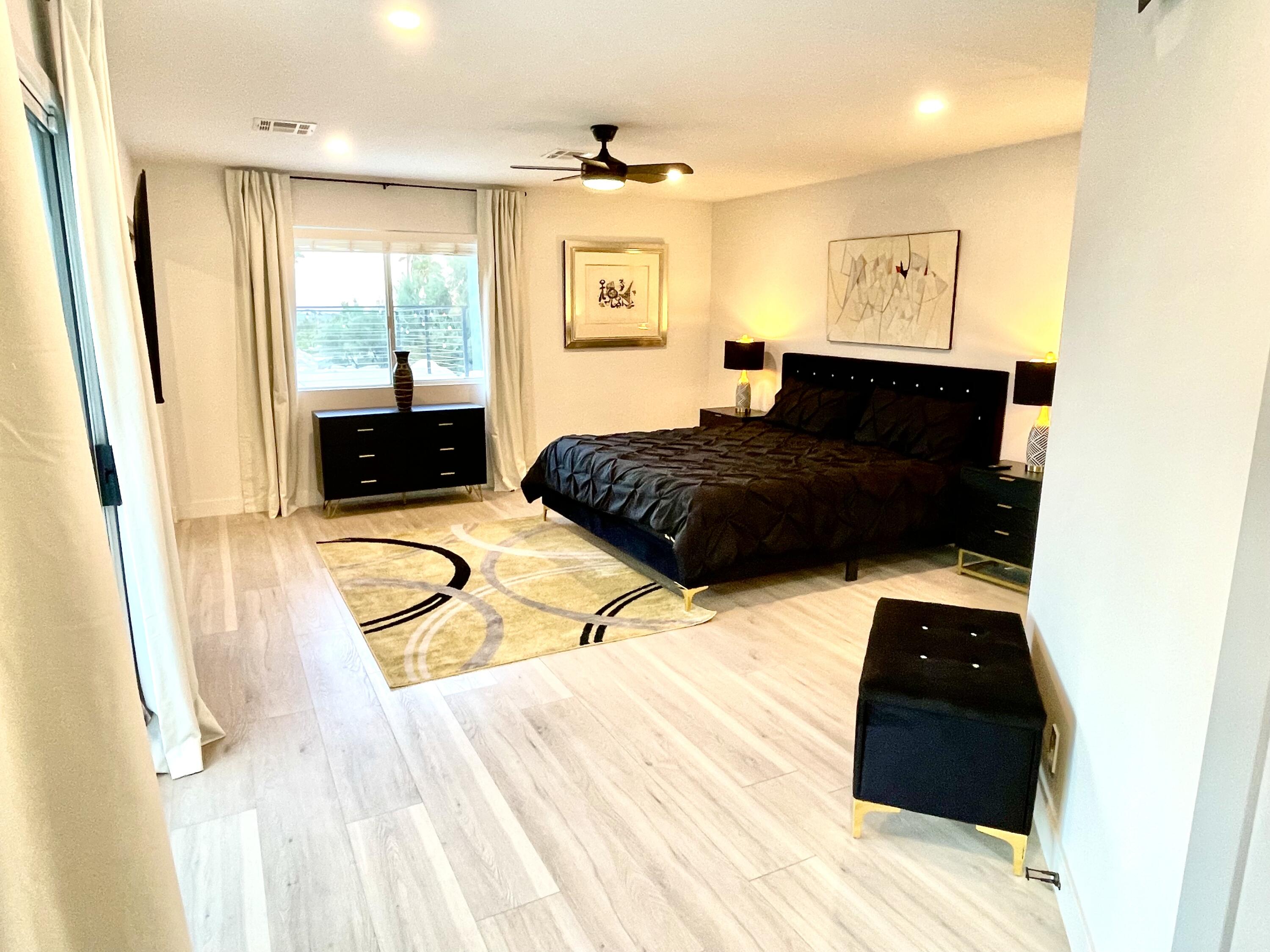 2380 North Leonard Road Palm Springs, CA 92262 - Photo 20 of 54 a bedroom with a bed window and a table