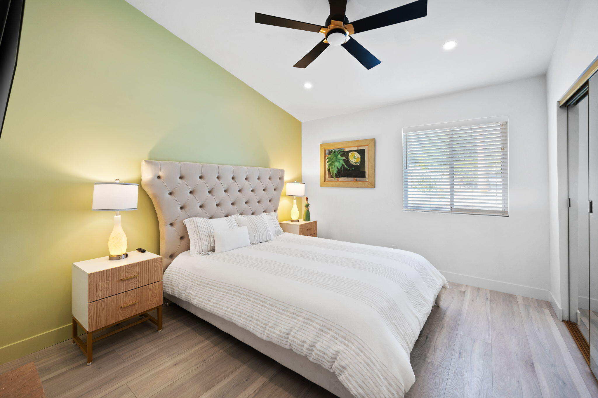 2380 North Leonard Road Palm Springs, CA 92262 - Photo 27 of 54 a bedroom with a bed and wooden floor