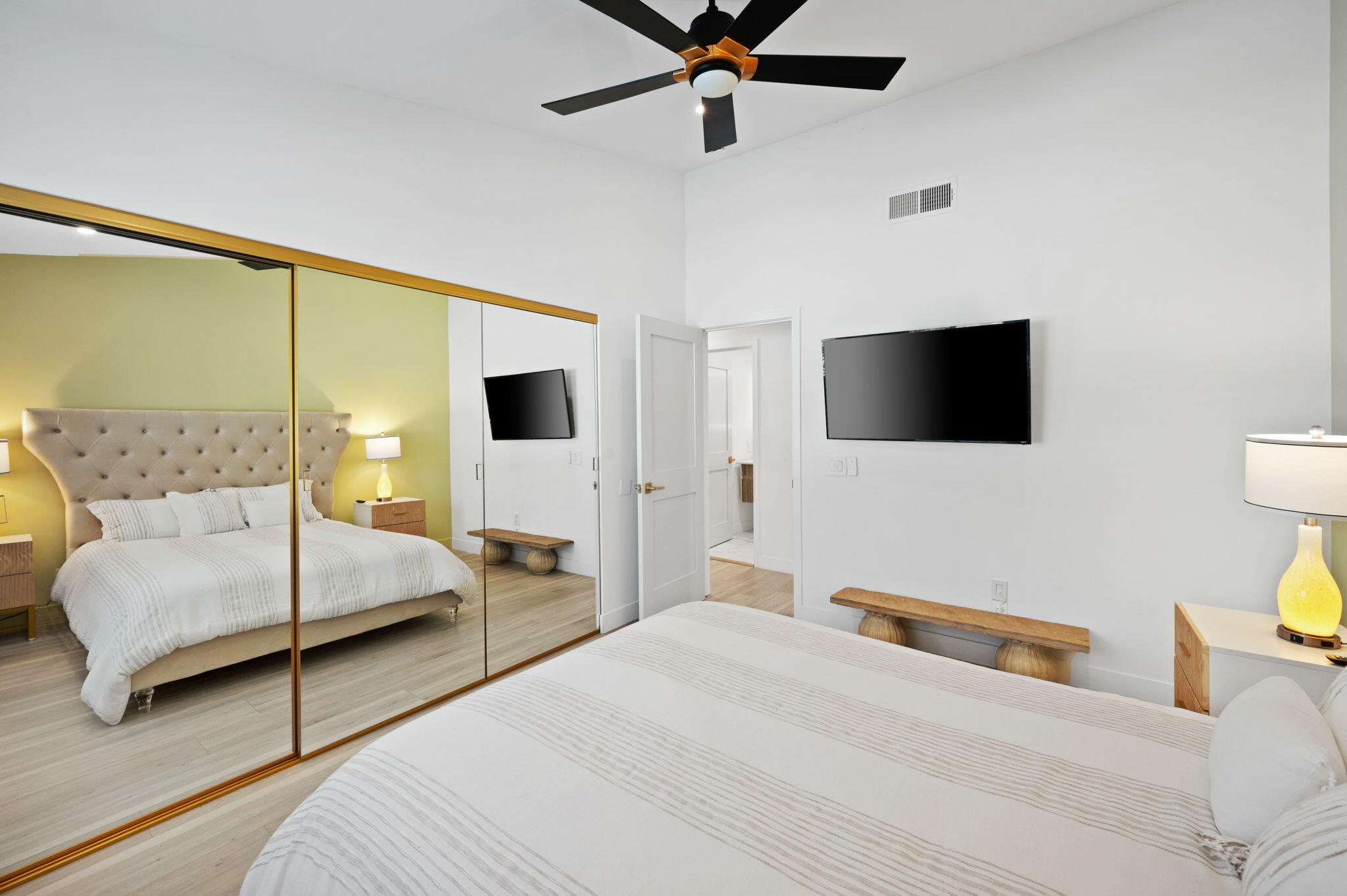 2380 North Leonard Road Palm Springs, CA 92262 - Photo 28 of 54 a bedroom with a bed and flat screen tv