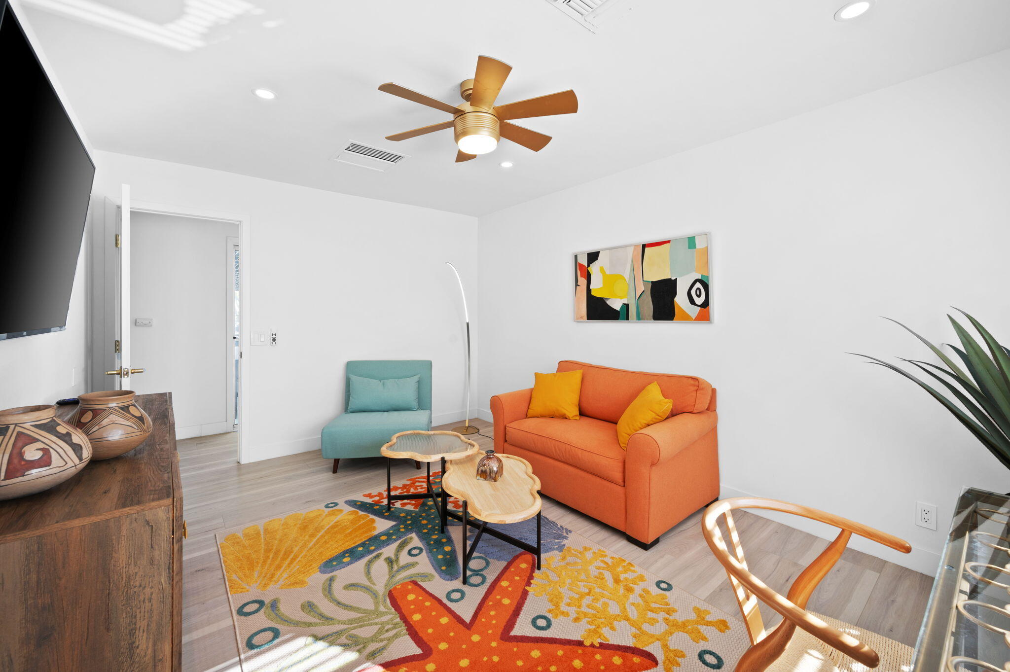 2380 North Leonard Road Palm Springs, CA 92262 - Photo 33 of 54 a living room with furniture and a flat screen tv