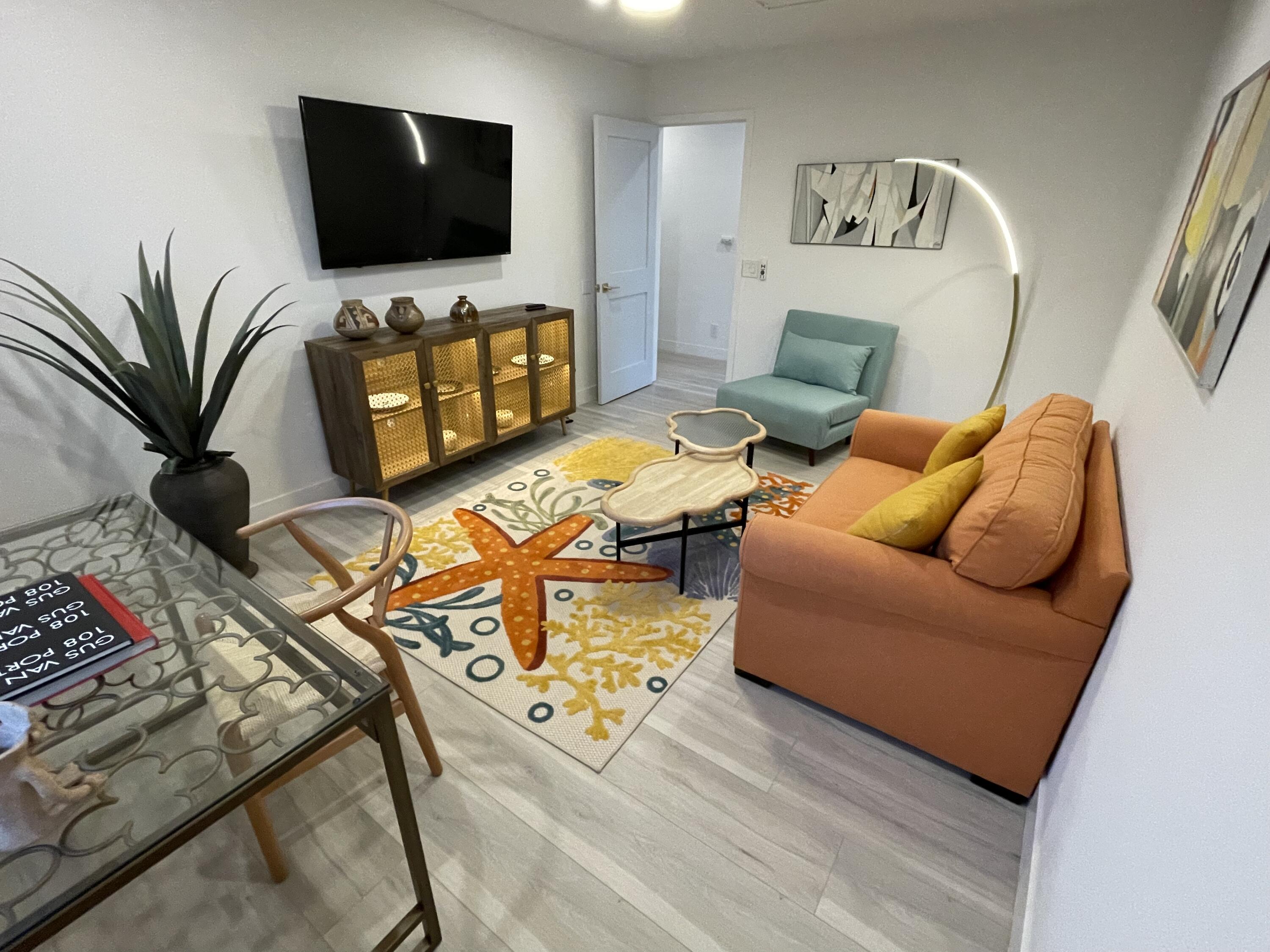 2380 North Leonard Road Palm Springs, CA 92262 - Photo 34 of 54 a living room with furniture and a flat screen tv