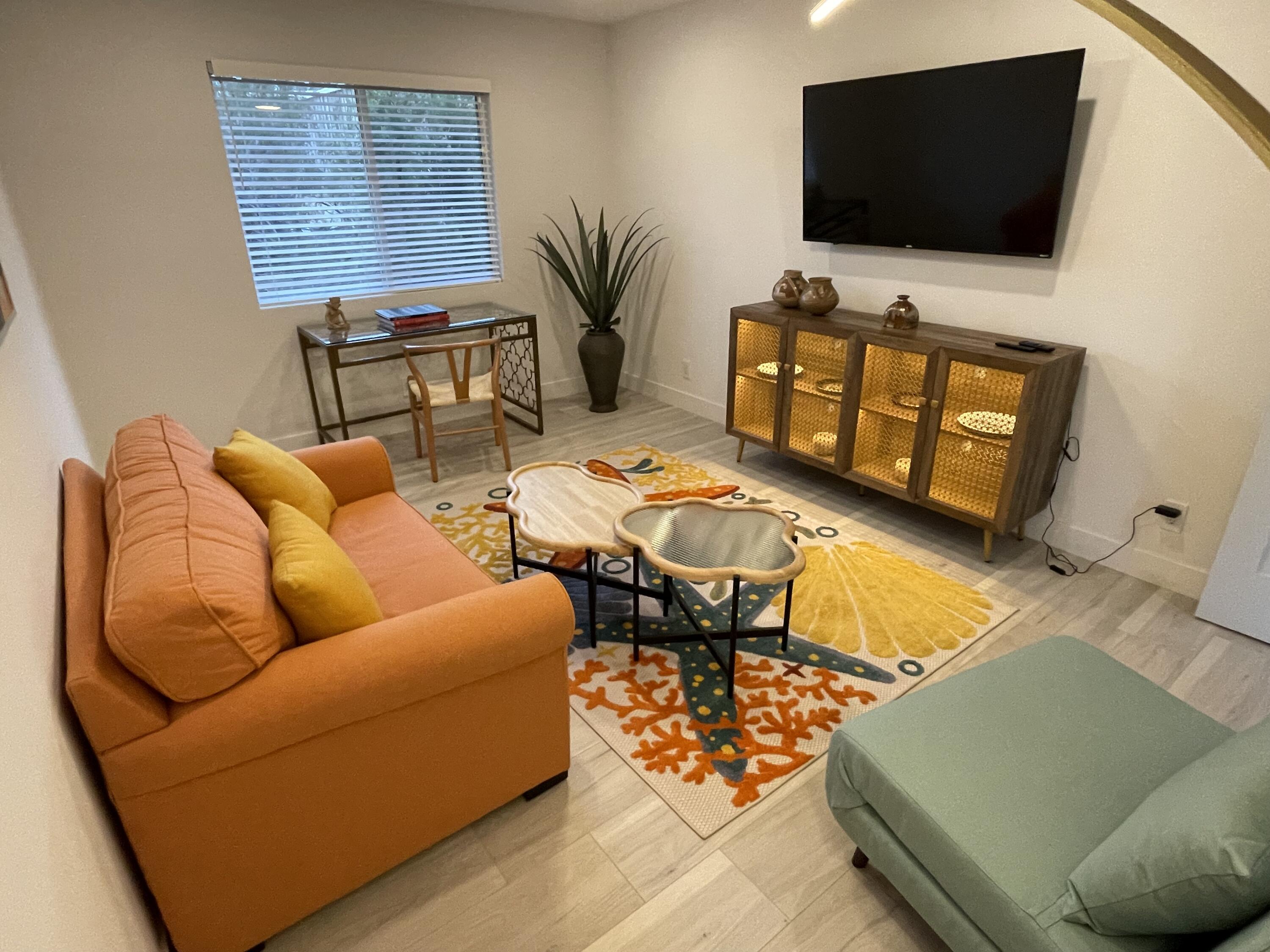 2380 North Leonard Road Palm Springs, CA 92262 - Photo 36 of 54 a living room with furniture and a flat screen tv