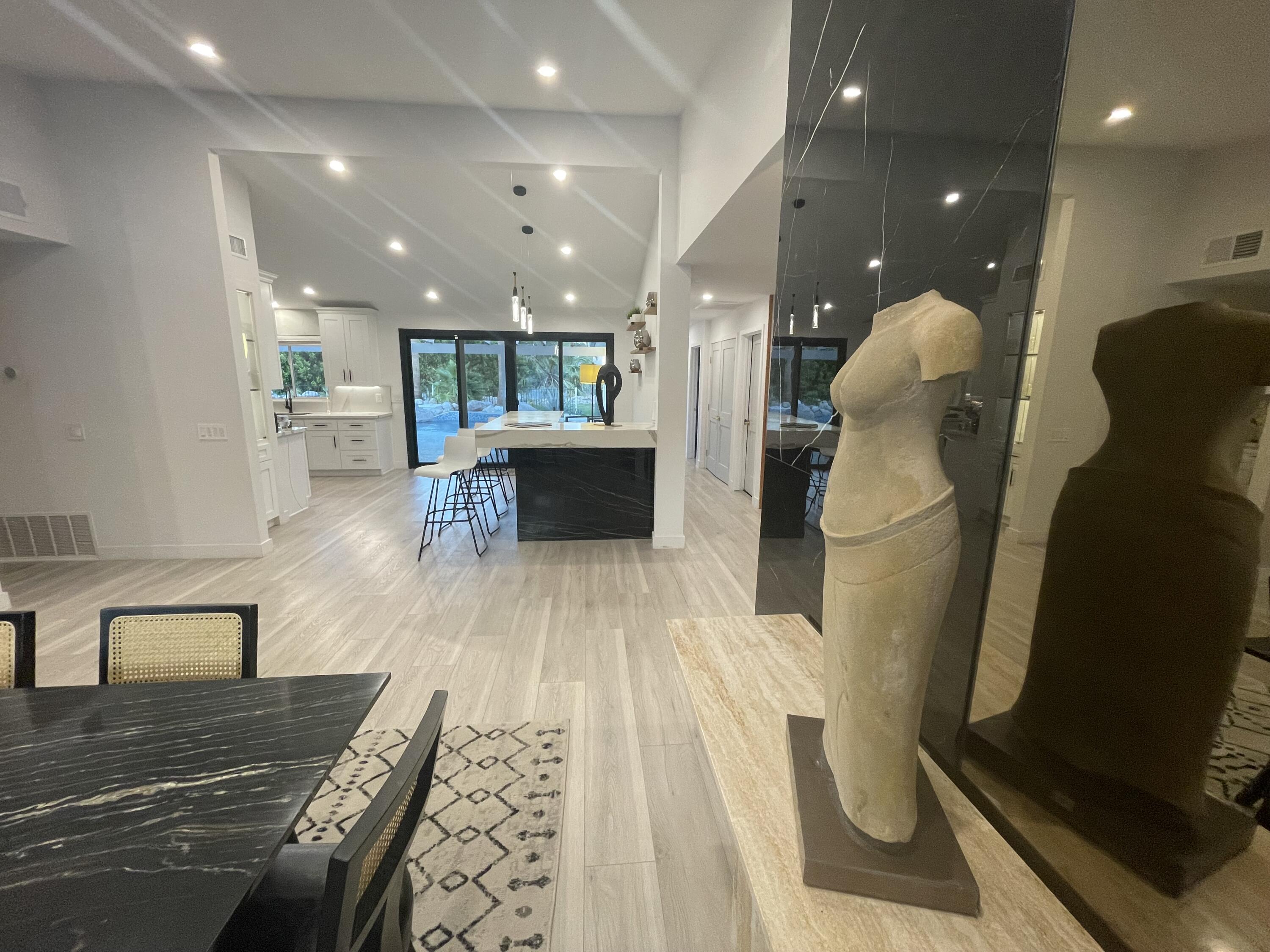 2380 North Leonard Road Palm Springs, CA 92262 - Photo 51 of 54 a living room with furniture and a wooden floor