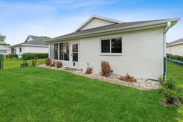 a front view of house with yard and outdoor seating