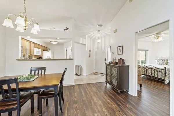 a view of a dining room with furniture and wooden floor