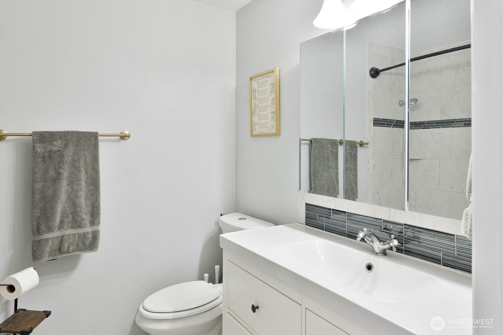 6028 South Prospect Street Tacoma, WA 98409 - Photo 15 of 32 a bathroom with a sink a toilet and shower