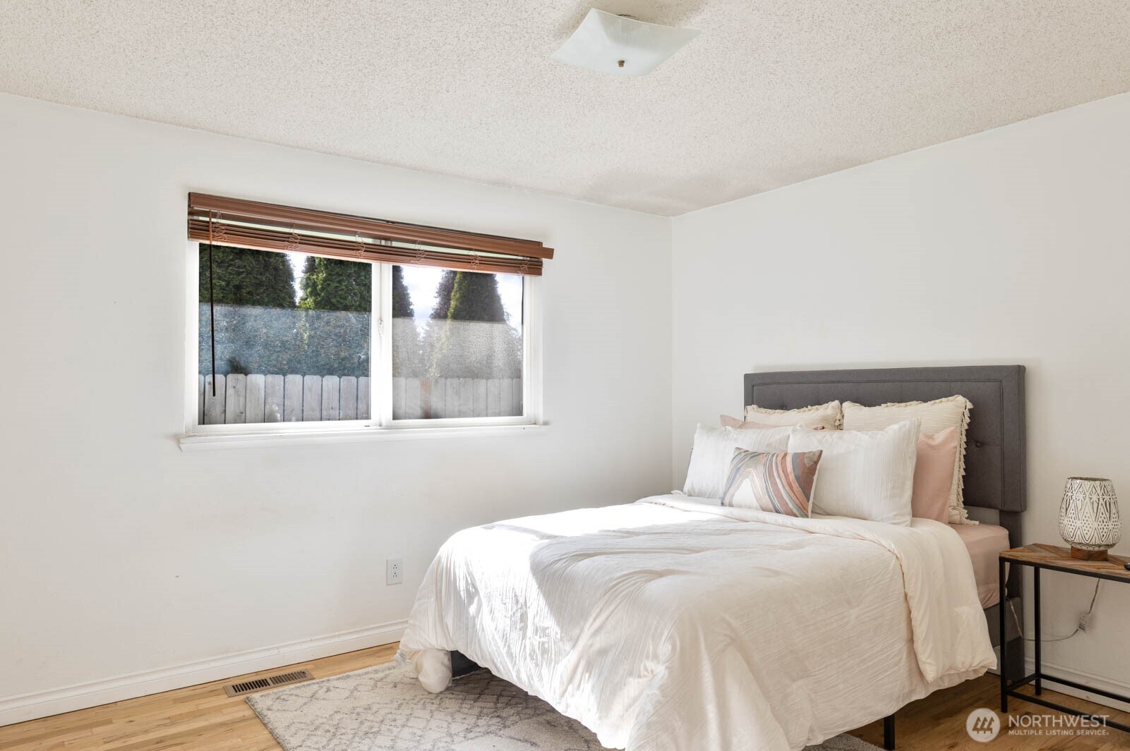6028 South Prospect Street Tacoma, WA 98409 - Photo 20 of 32 a bedroom with a bed and a window