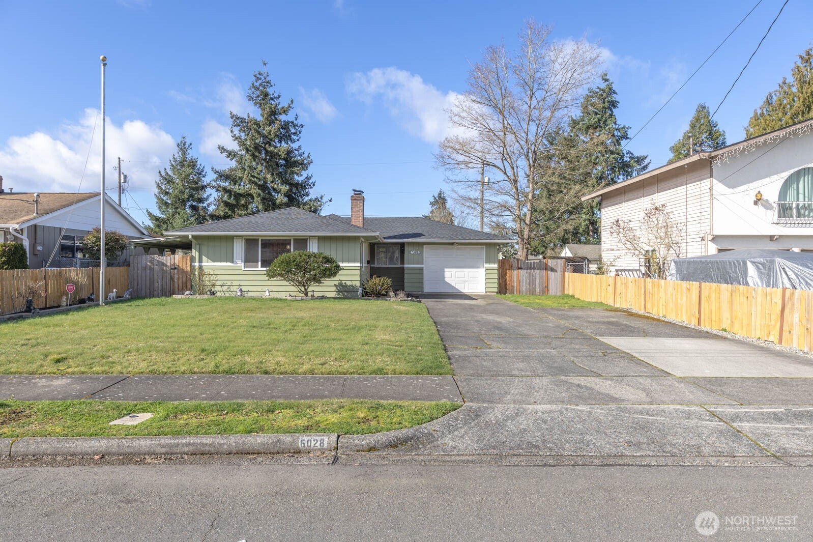 6028 South Prospect Street Tacoma, WA 98409 - Photo 2 of 32 a view of house with outdoor space and porch