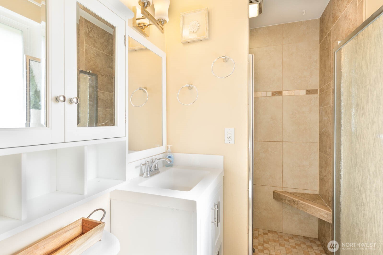 6028 South Prospect Street Tacoma, WA 98409 - Photo 21 of 32 a bathroom with a sink and a mirror