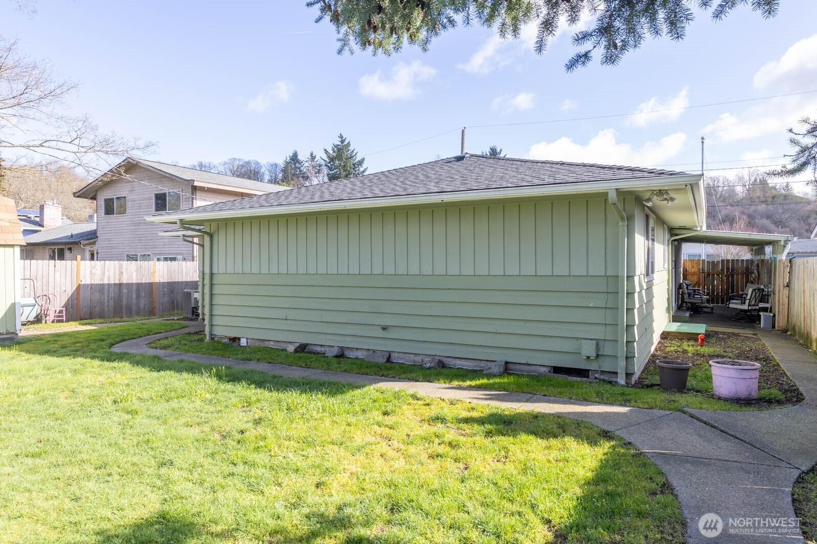 6028 South Prospect Street Tacoma, WA 98409 - Photo 23 of 32 a view of a backyard with a garden