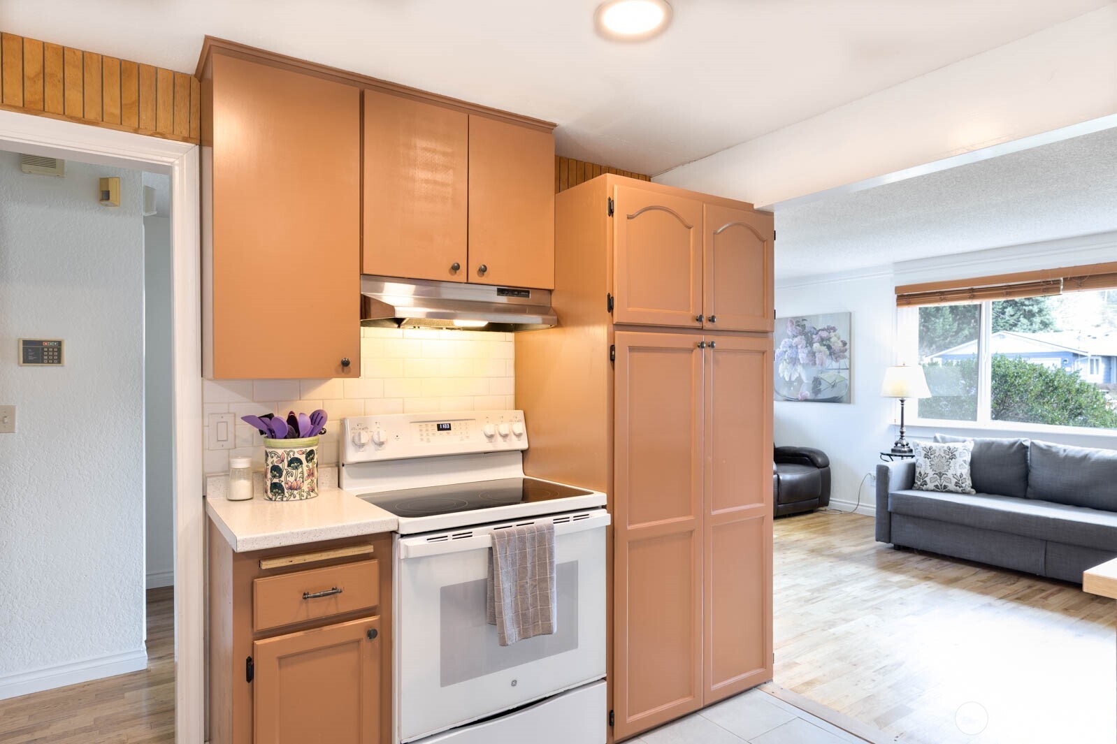 6028 South Prospect Street Tacoma, WA 98409 - Photo 10 of 32 a kitchen with a refrigerator and a sink