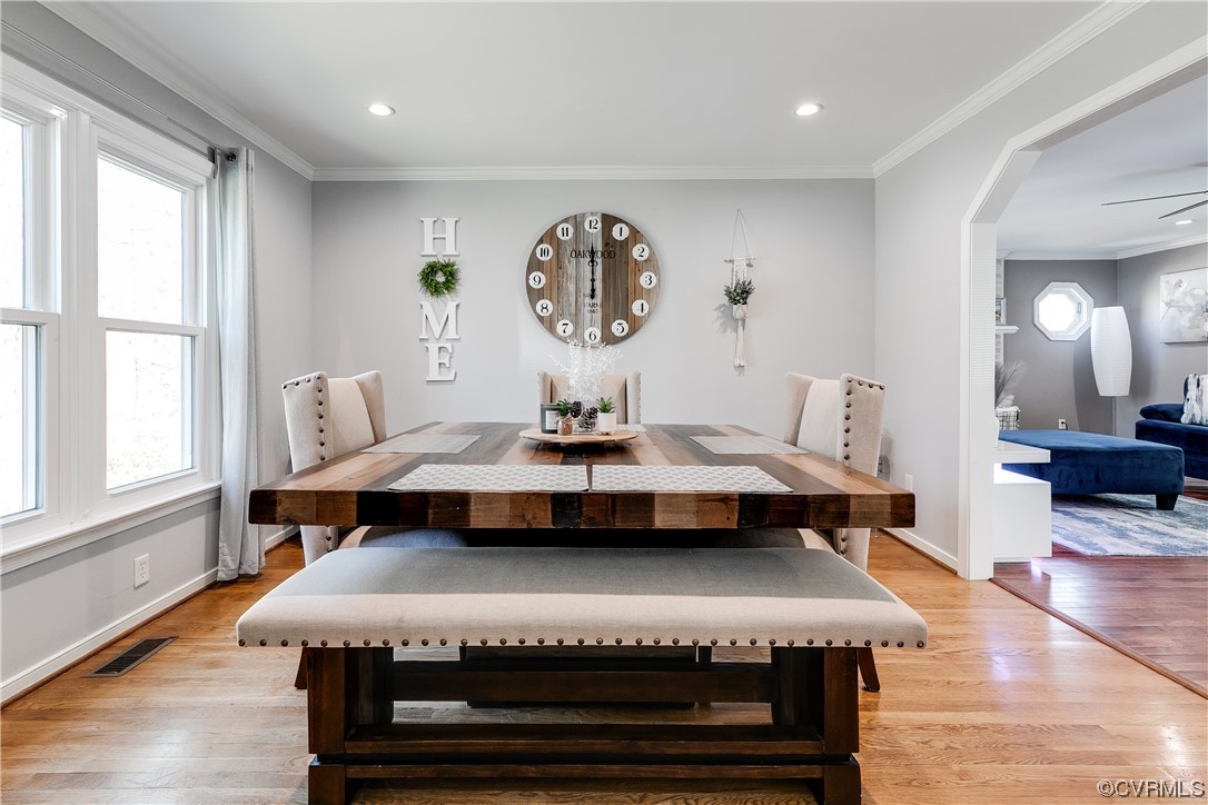 10811 Crofton Road Chester, VA 23831 - Photo 12 of 50 a living room with a table chairs and a large window