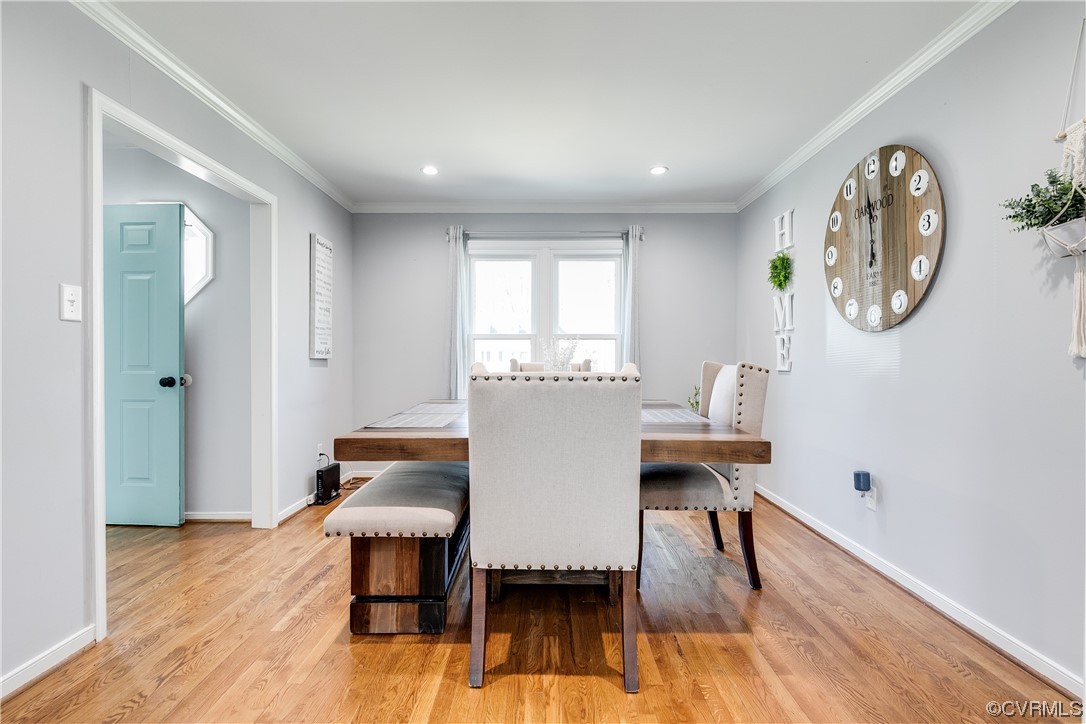 10811 Crofton Road Chester, VA 23831 - Photo 14 of 50 a view of a dining room with furniture and wooden floor