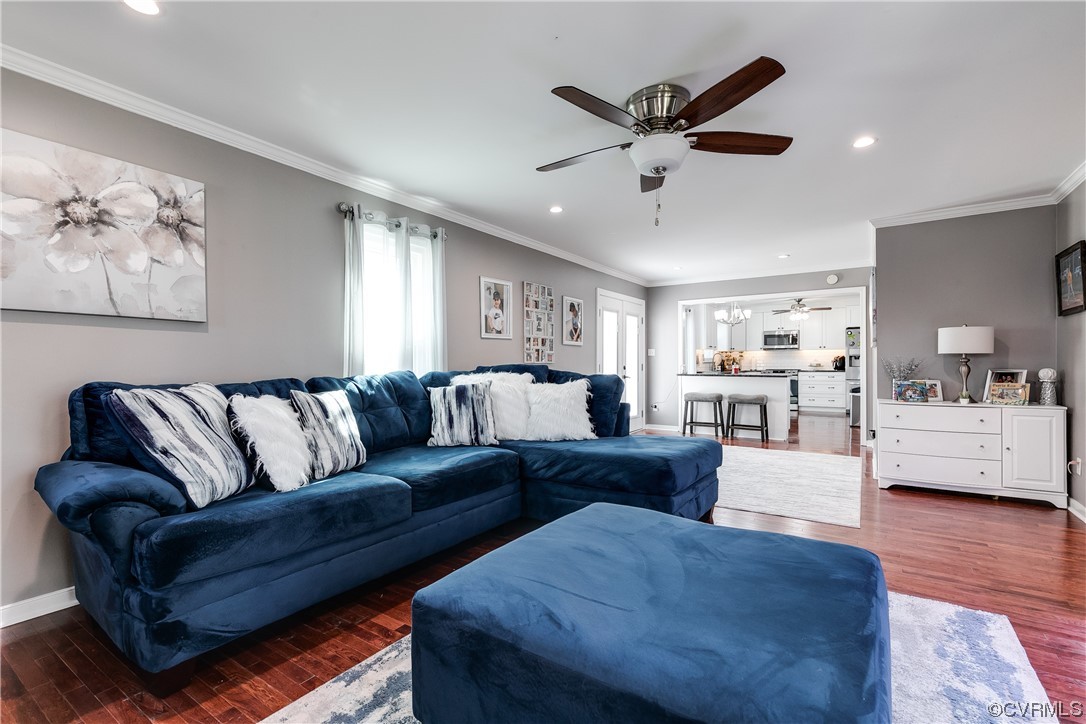 10811 Crofton Road Chester, VA 23831 - Photo 19 of 50 a view of a livingroom with furniture and a ceiling fan