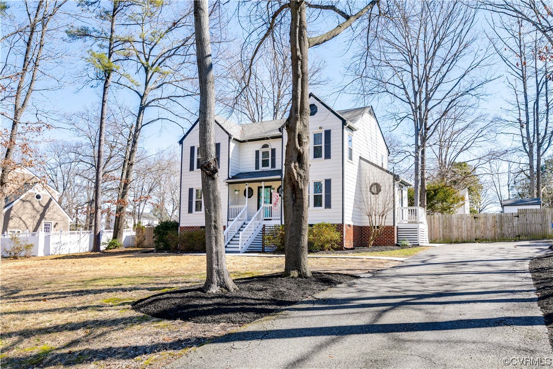 10811 Crofton Road Chester, VA 23831 - Photo 2 of 50 a front view of a building with trees