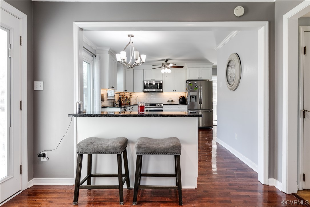 10811 Crofton Road Chester, VA 23831 - Photo 22 of 50 a kitchen with dining table and chairs