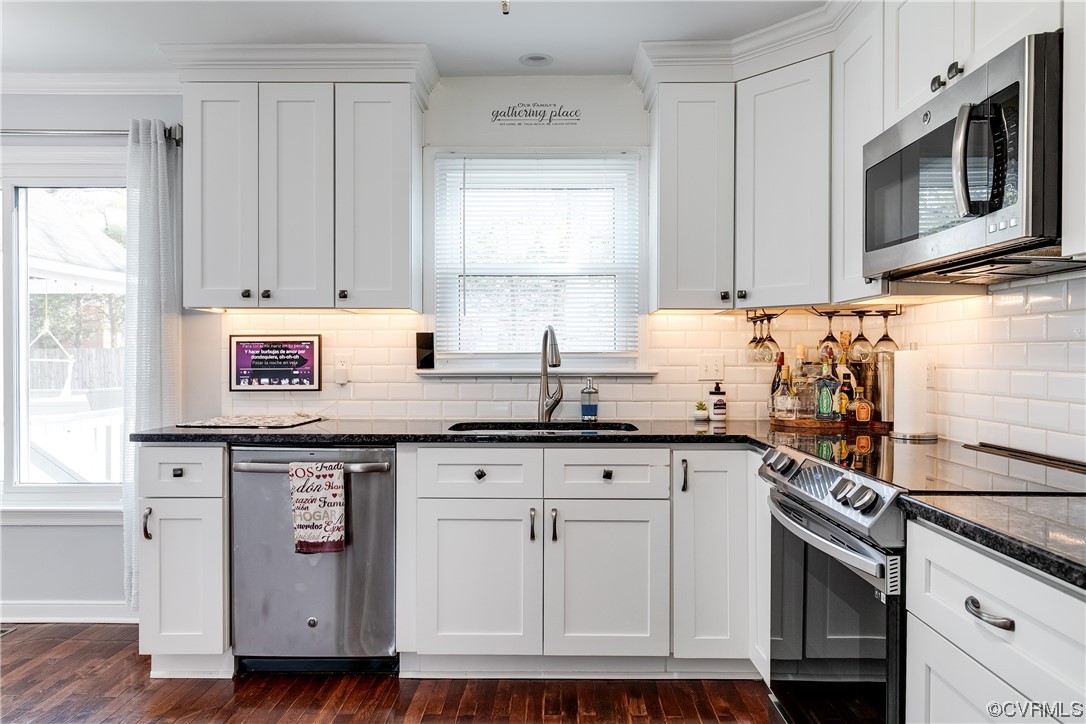 10811 Crofton Road Chester, VA 23831 - Photo 25 of 50 a kitchen with stainless steel appliances granite countertop a sink stove and microwave