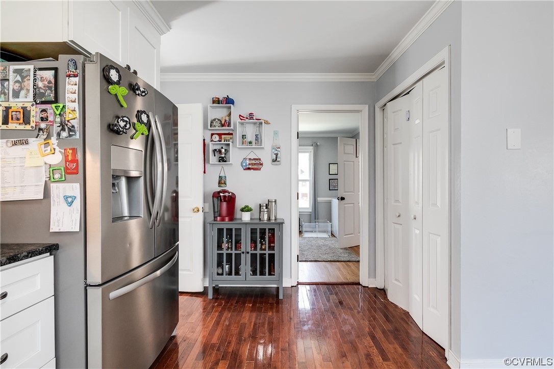 10811 Crofton Road Chester, VA 23831 - Photo 27 of 50 a kitchen with stainless steel appliances a refrigerator and a hard wood floor