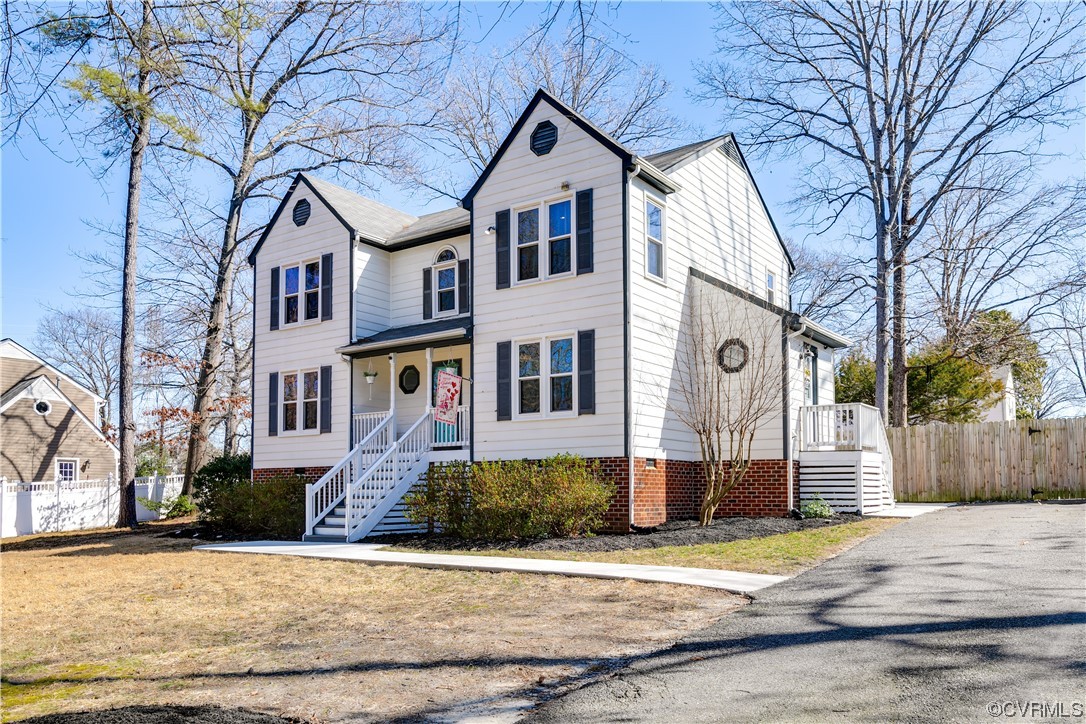 10811 Crofton Road Chester, VA 23831 - Photo 3 of 50 a front view of a house with a yard and garage