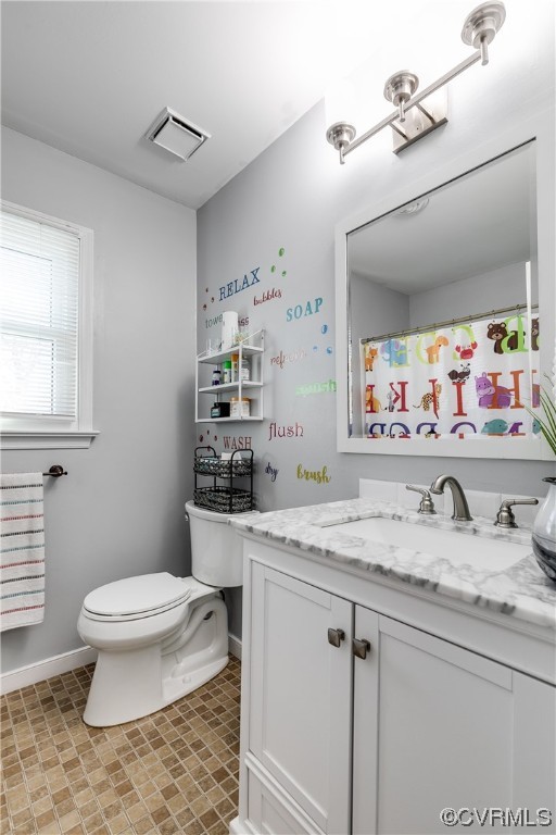 10811 Crofton Road Chester, VA 23831 - Photo 31 of 50 a bathroom with a granite countertop sink mirror vanity and toilet