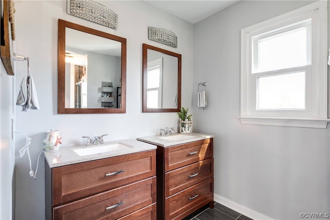 10811 Crofton Road Chester, VA 23831 - Photo 34 of 50 a bathroom with a sink mirror and window