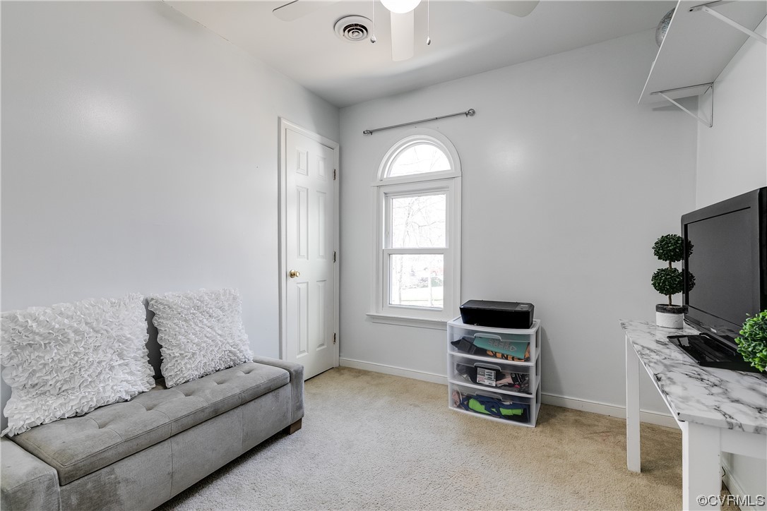 10811 Crofton Road Chester, VA 23831 - Photo 37 of 50 a living room with furniture and a flat screen tv