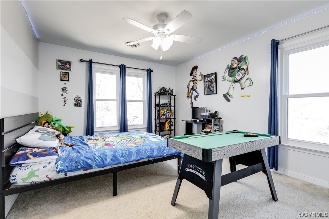 10811 Crofton Road Chester, VA 23831 - Photo 39 of 50 a bedroom that has a bed and a table in it