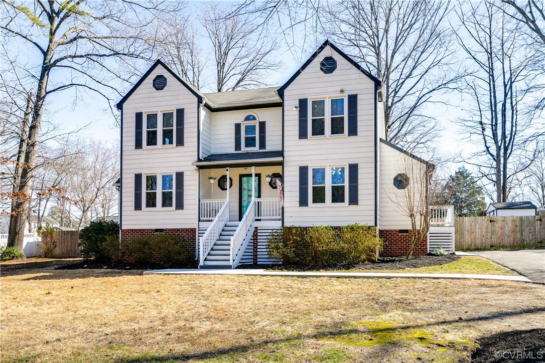 10811 Crofton Road Chester, VA 23831 - Photo 4 of 50 a front view of a house with a yard