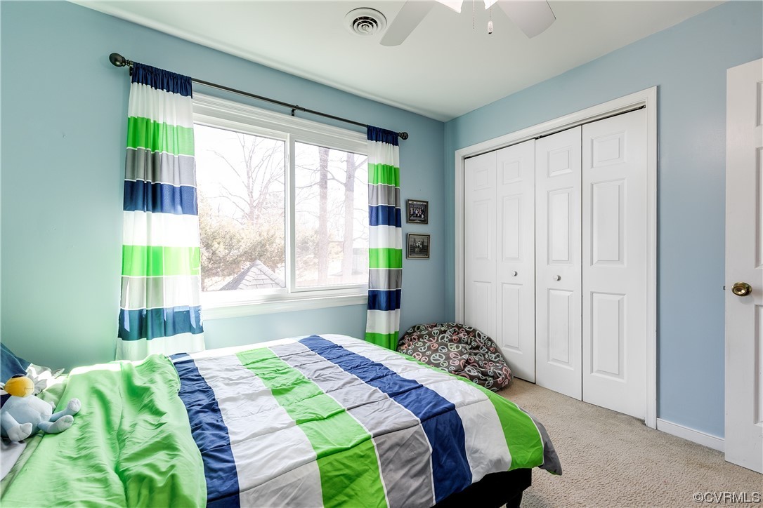 10811 Crofton Road Chester, VA 23831 - Photo 42 of 50 a bedroom with a bed and a window