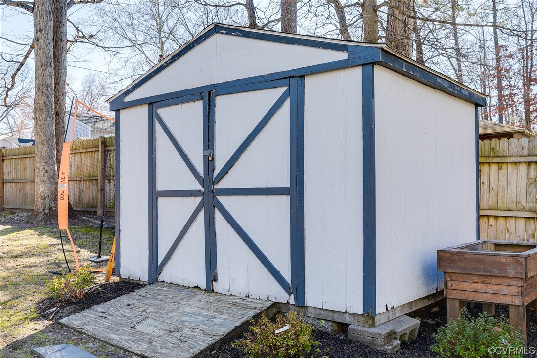 10811 Crofton Road Chester, VA 23831 - Photo 49 of 50 a backyard of a house with table and chairs