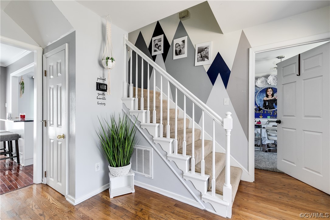 10811 Crofton Road Chester, VA 23831 - Photo 9 of 50 a view of entryway with wooden floor and stairs