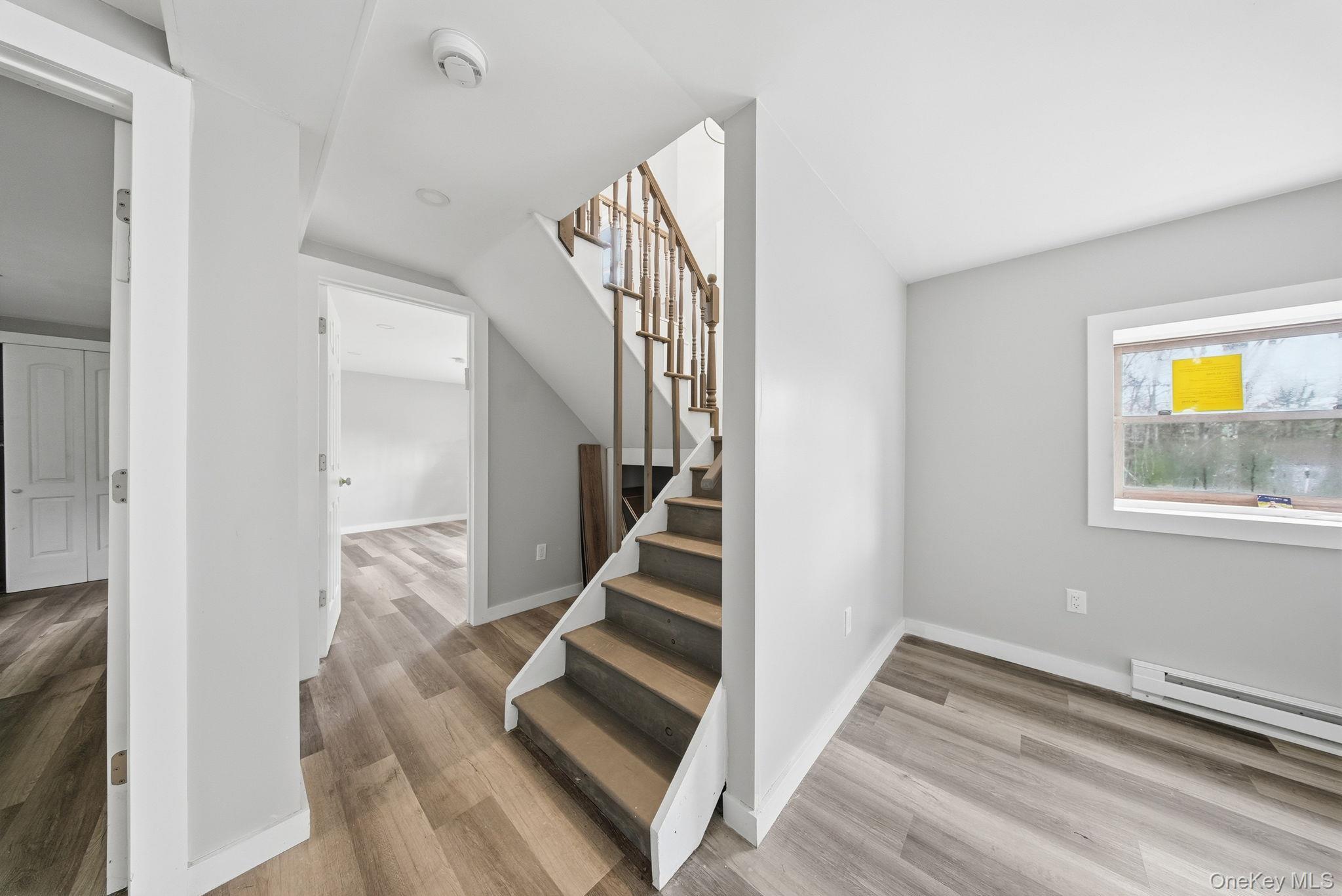 39 Dingle Daisy Road Monticello, NY 12701 - Photo 20 of 36 a view of entryway and hall with wooden floor