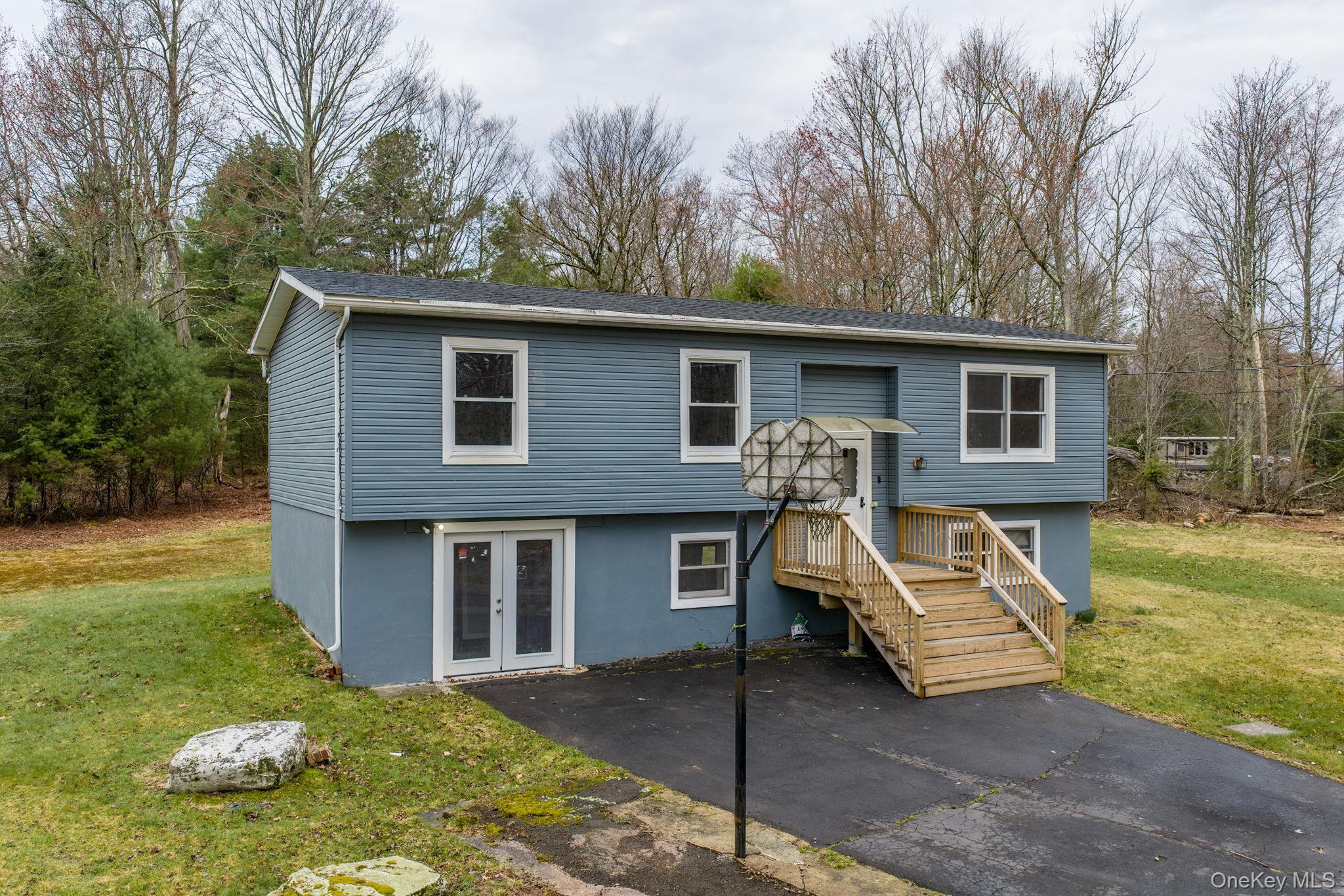 39 Dingle Daisy Road Monticello, NY 12701 - Photo 2 of 36 a front view of a house with garden