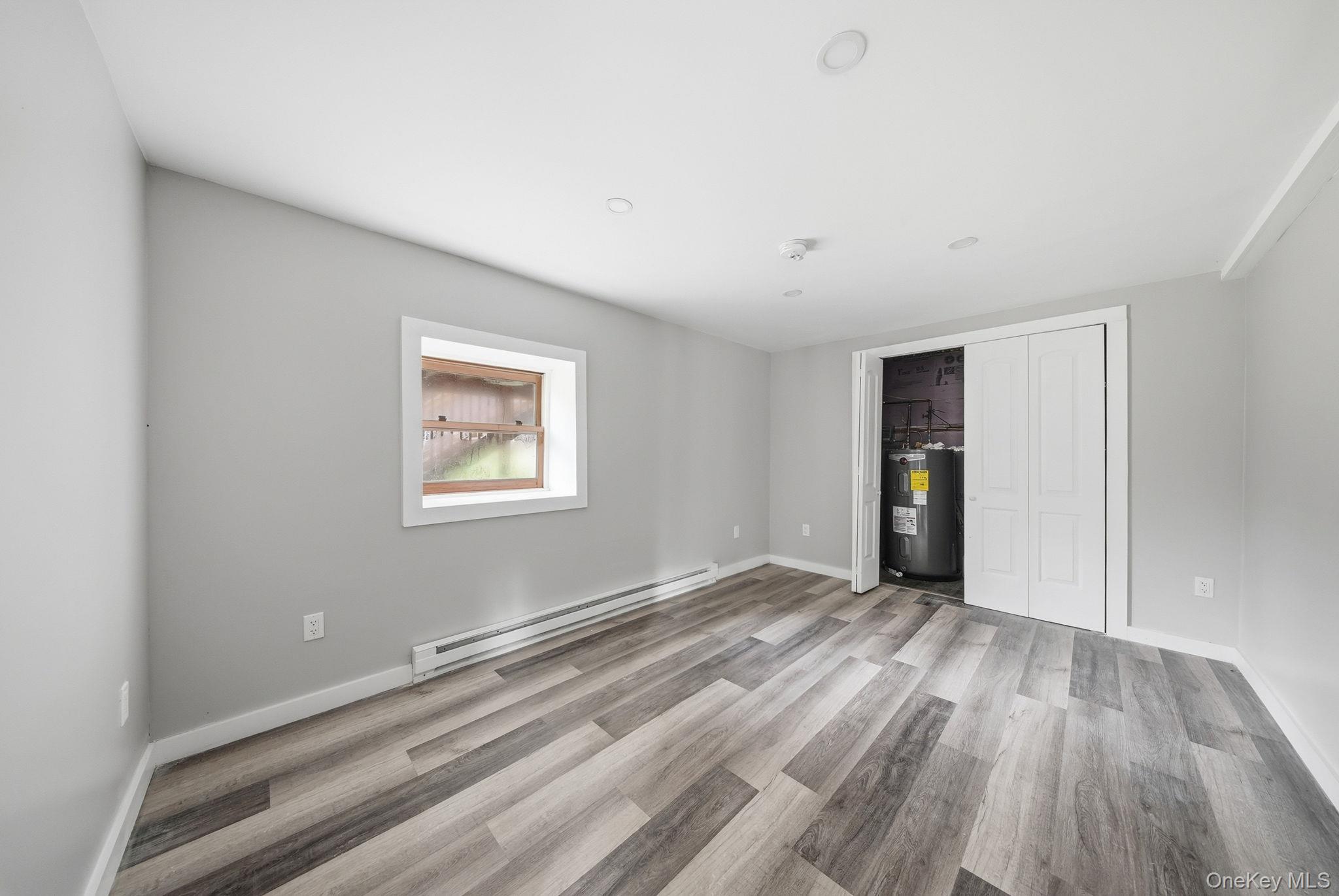 39 Dingle Daisy Road Monticello, NY 12701 - Photo 22 of 36 a view of an empty room with closet and a window