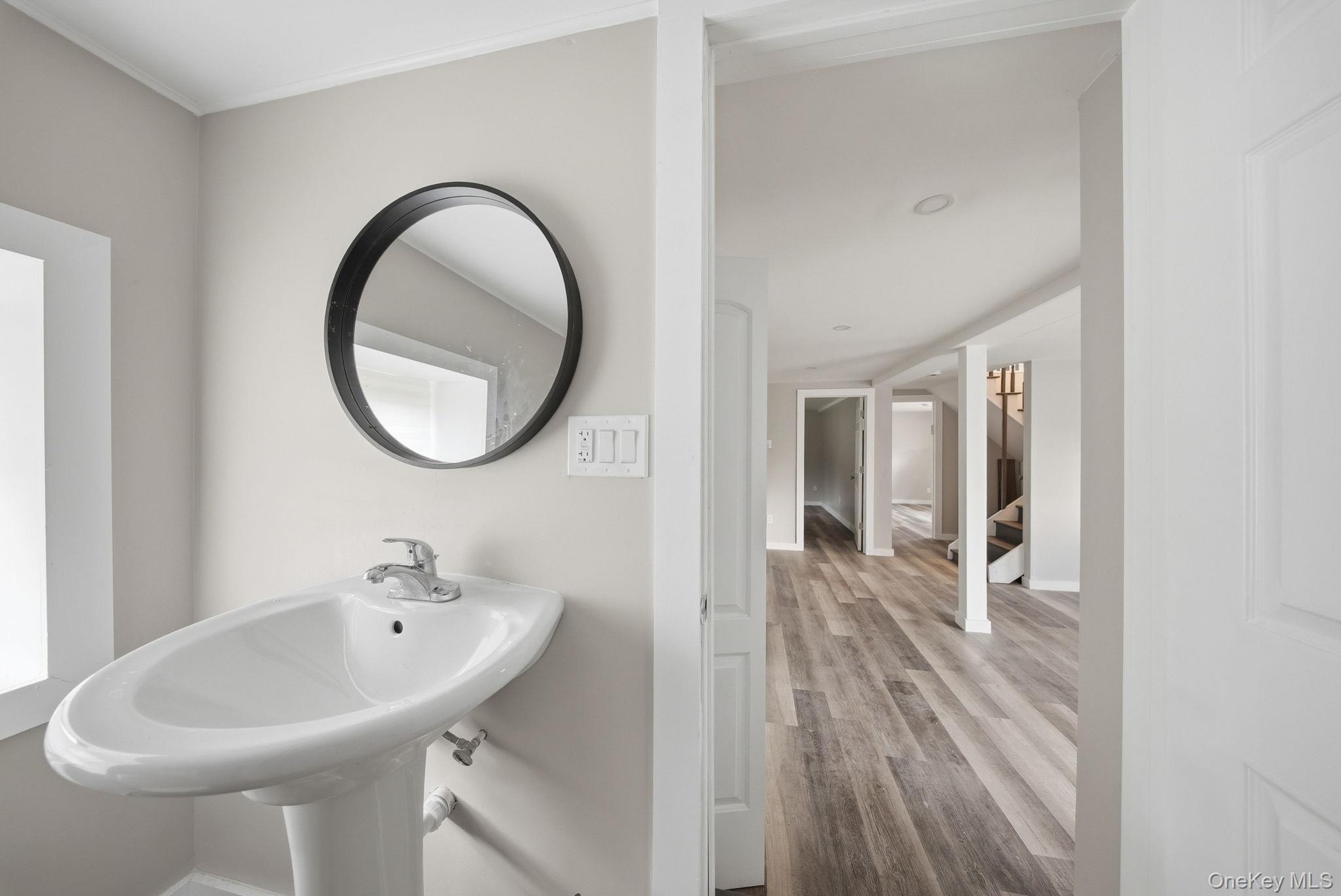 39 Dingle Daisy Road Monticello, NY 12701 - Photo 24 of 36 a bathroom with a sink and a mirror