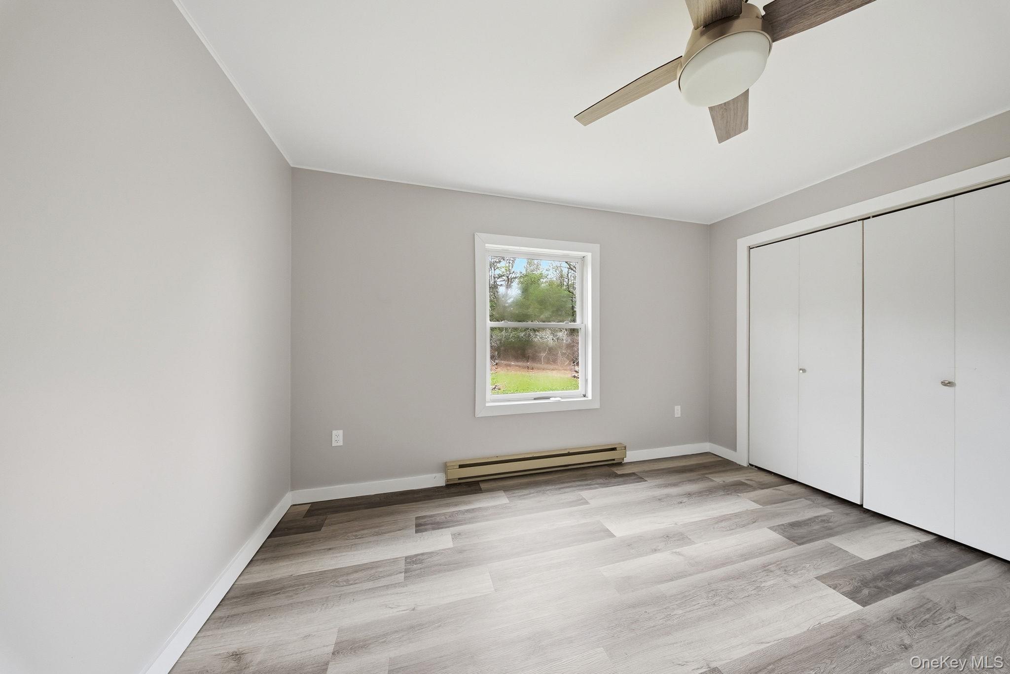 39 Dingle Daisy Road Monticello, NY 12701 - Photo 28 of 36 an empty room with a empty space and windows